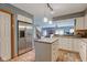 Modern kitchen showcases stainless steel refrigerator, island, and open layout connecting to the living area at 5372 Bay Harbor Dr, Indianapolis, IN 46254