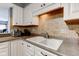 Kitchen features double sink, tile backsplash, and plenty of counter space for meal preparation at 5372 Bay Harbor Dr, Indianapolis, IN 46254