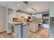 Bright kitchen with white cabinets, modern appliances, and tile flooring at 5372 Bay Harbor Dr, Indianapolis, IN 46254