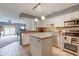 Bright kitchen features white cabinets, stainless steel appliances, and a convenient center island for added workspace at 5372 Bay Harbor Dr, Indianapolis, IN 46254