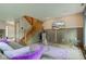 Inviting living space with a staircase, television, and comfortable seating at 5372 Bay Harbor Dr, Indianapolis, IN 46254