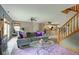 Open-concept living room with a view of the kitchen and staircase at 5372 Bay Harbor Dr, Indianapolis, IN 46254