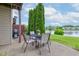 Outdoor patio with seating, grill, and view of the lake in a serene setting at 5372 Bay Harbor Dr, Indianapolis, IN 46254