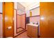 Bathroom featuring a shower, vanity with mirror, and neutral pink tiling at 5388 W Hazelrigg Rd, Thorntown, IN 46071