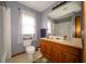 Bathroom with a tub and shower combination, tile flooring and wooden vanity at 5388 W Hazelrigg Rd, Thorntown, IN 46071