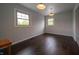 Empty bedroom features hardwood floors, natural light and closet at 5388 W Hazelrigg Rd, Thorntown, IN 46071