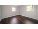 Bedroom with hardwood floors and two windows that let in plenty of natural light at 5388 W Hazelrigg Rd, Thorntown, IN 46071