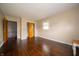 Bedroom with hardwood floors, closet, and a view to the hallway and stairs at 5388 W Hazelrigg Rd, Thorntown, IN 46071
