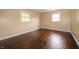 Bedroom with hardwood floors and natural light from two windows at 5388 W Hazelrigg Rd, Thorntown, IN 46071