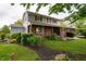 Well-maintained two-story house with brick accents and lush landscaping at 5388 W Hazelrigg Rd, Thorntown, IN 46071