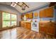 Bright kitchen features wood cabinets, a vintage stove, wooden countertops, and a rustic aesthetic at 5388 W Hazelrigg Rd, Thorntown, IN 46071