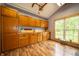 Cozy kitchen features custom wood cabinets, wooden countertops, and a large window at 5388 W Hazelrigg Rd, Thorntown, IN 46071