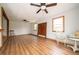 Spacious living room with ceiling fan, laminate floors and neutral paint at 5388 W Hazelrigg Rd, Thorntown, IN 46071