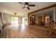 Open living room with wood beam detail and sliding door to the backyard at 5388 W Hazelrigg Rd, Thorntown, IN 46071