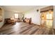 Spacious living room with wood-look floors and lots of natural light at 5388 W Hazelrigg Rd, Thorntown, IN 46071