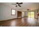 Bright living room features wood floors, ceiling fans, and sliding door to the outdoors at 5388 W Hazelrigg Rd, Thorntown, IN 46071