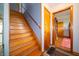 Classic wooden staircase leading to the upper level with natural light at 5388 W Hazelrigg Rd, Thorntown, IN 46071