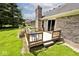View of cozy wooden back deck with furniture and access to yard at 551 Windward Ln, Plainfield, IN 46168