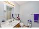 Clean bathroom with a vanity sink, toilet, and practical storage solutions at 551 Windward Ln, Plainfield, IN 46168