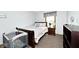 Bedroom with a dark wood bed, wood-look floors, and soft blue walls at 551 Windward Ln, Plainfield, IN 46168