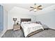 Cozy bedroom featuring a ceiling fan, vaulted ceiling, and a comfortable bed at 551 Windward Ln, Plainfield, IN 46168