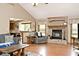 Comfortable living room with a brick fireplace, vaulted ceiling, and hardwood floors at 551 Windward Ln, Plainfield, IN 46168