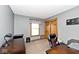 Home office area with a wooden desk, rolling chair, and natural light at 551 Windward Ln, Plainfield, IN 46168