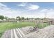 Large backyard with a wooden deck, swing set, and a spacious grassy area perfect for outdoor activities and relaxation at 555 Echo Bend Blvd, Greenwood, IN 46142