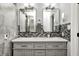 Bathroom featuring double sinks, gray cabinetry and modern decor at 555 Echo Bend Blvd, Greenwood, IN 46142