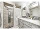 Beautiful bathroom featuring a double vanity, modern mirrors, and glass enclosed shower at 555 Echo Bend Blvd, Greenwood, IN 46142