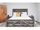 Cozy bedroom featuring modern decor, a gray wood bed frame and matching nightstands at 555 Echo Bend Blvd, Greenwood, IN 46142