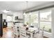 Open dining area with abundant natural light and seating for four at 555 Echo Bend Blvd, Greenwood, IN 46142