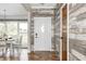 Inviting entryway featuring wood-look floors and decorative wood accent wall at 555 Echo Bend Blvd, Greenwood, IN 46142