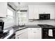 Modern kitchen featuring white cabinetry, granite countertops, and stainless steel appliances at 555 Echo Bend Blvd, Greenwood, IN 46142