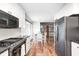 Open kitchen flowing into dining area, highlighting modern cabinetry and countertops at 555 Echo Bend Blvd, Greenwood, IN 46142
