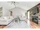 Spacious living room featuring vaulted ceiling, wood-look floors, and cozy fireplace at 555 Echo Bend Blvd, Greenwood, IN 46142