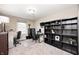A home office with a desk, shelves, and a window providing natural light, creating an ideal work-from-home environment at 555 Echo Bend Blvd, Greenwood, IN 46142