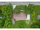 Aerial view of a home with mature trees, shed, driveway and a metal roof at 6348 W 750 N, McCordsville, IN 46055