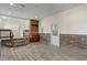 A spacious finished basement with wood-look floors, complemented by stone wall accents and a bar area at 6348 W 750 N, McCordsville, IN 46055