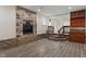 A finished basement features a stone fireplace and wood-look flooring at 6348 W 750 N, McCordsville, IN 46055