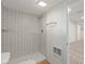 A bathroom with a step-in shower featuring white tile, complemented by modern fixtures and finishes at 6348 W 750 N, McCordsville, IN 46055