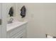 Neat bathroom showcasing white vanity, mirror, towel, and a toilet paper holder at 6348 W 750 N, McCordsville, IN 46055