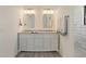 A double vanity in a well-lit bathroom with granite countertops and white cabinets at 6348 W 750 N, McCordsville, IN 46055