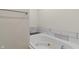 Bathroom with a large soaking tub with jets and stone-look tile surround at 6348 W 750 N, McCordsville, IN 46055