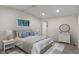A cozy bedroom with neutral tones, a comfortable bed, and soft lighting on the nightstands at 6348 W 750 N, McCordsville, IN 46055