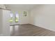 Bright room with French doors to the backyard and modern wood-look flooring at 6348 W 750 N, McCordsville, IN 46055