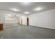 A spacious, three-car garage with an overhead door and concrete floors at 6348 W 750 N, McCordsville, IN 46055