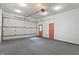 Spacious garage with automatic door opener, side entry door, and clean concrete floors at 6348 W 750 N, McCordsville, IN 46055