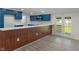 Modern kitchen featuring blue cabinets, a subway tile backsplash, and a butcher block countertop at 6348 W 750 N, McCordsville, IN 46055