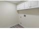 A bright laundry room with gray wood-look floors and white cabinets for storage needs at 6348 W 750 N, McCordsville, IN 46055